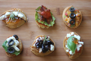 Broiled Pear and Apple Butter Crostini with Goat Cheese and Rosemary is on the top left. 